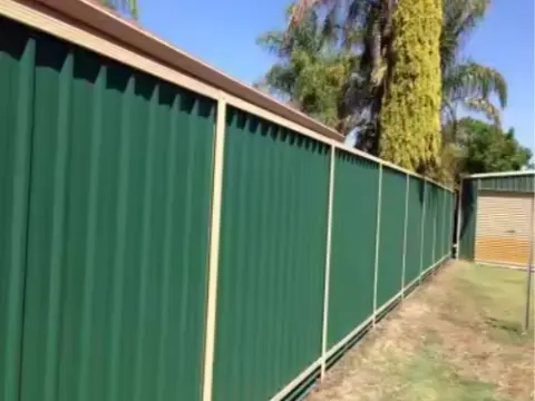 Green corrugated fence