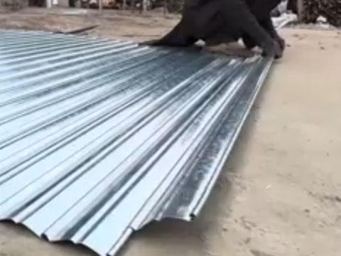Roller shutter door being assembled