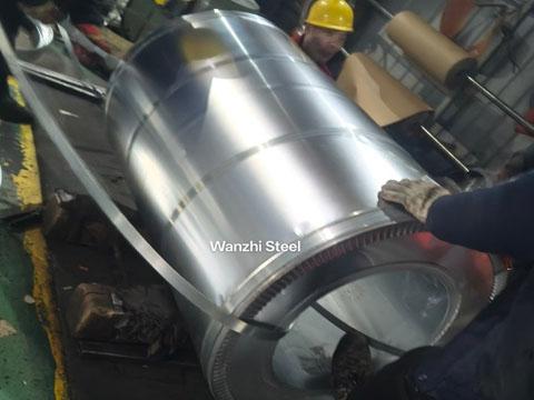 The produced steel coils are being packaged
